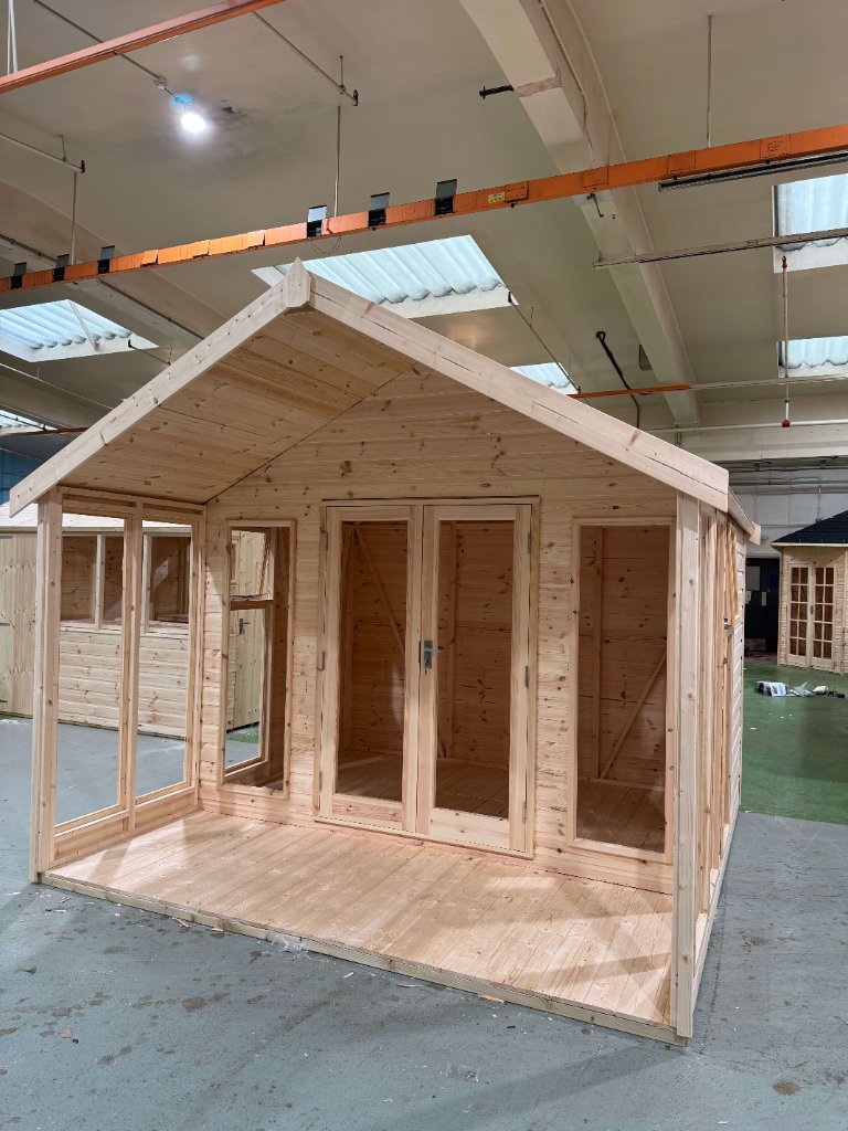 The Glasgow apex summerhouse - natural finish three-quarter angle with porch