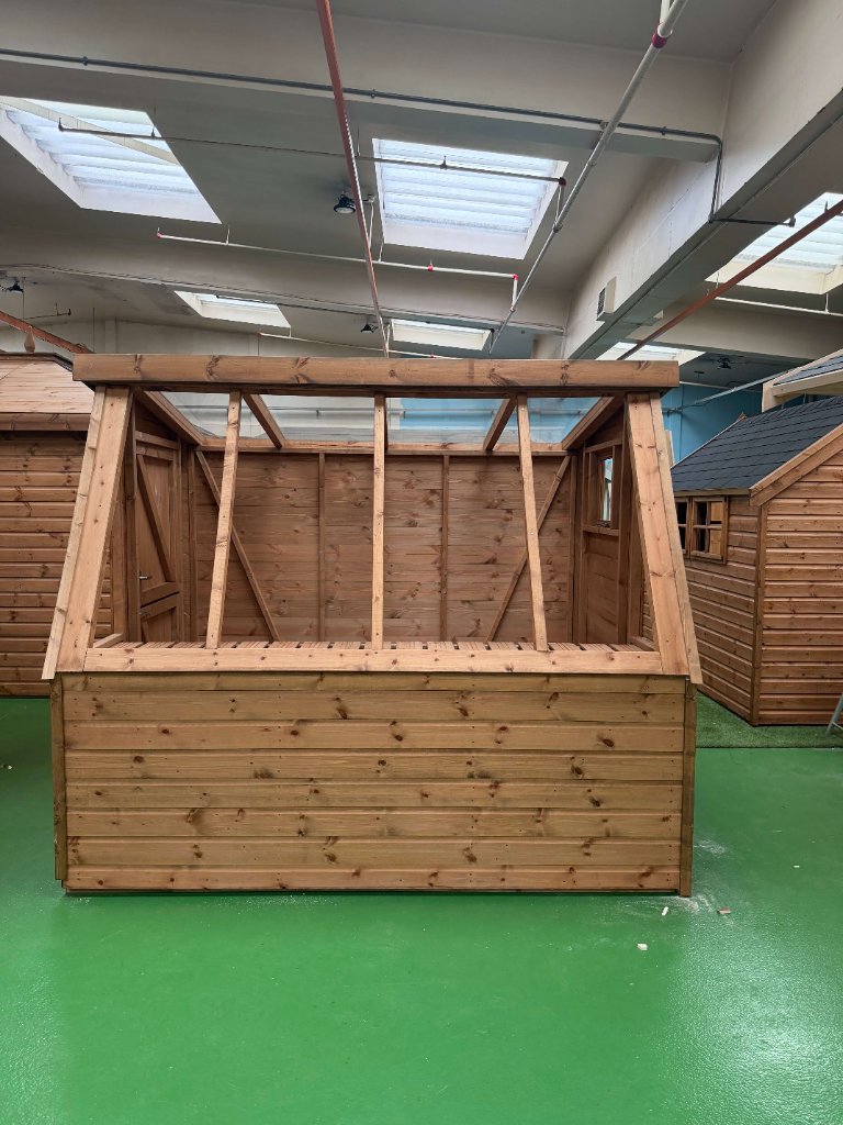 The Glastonbury potting shed - natural finish front view with open counter