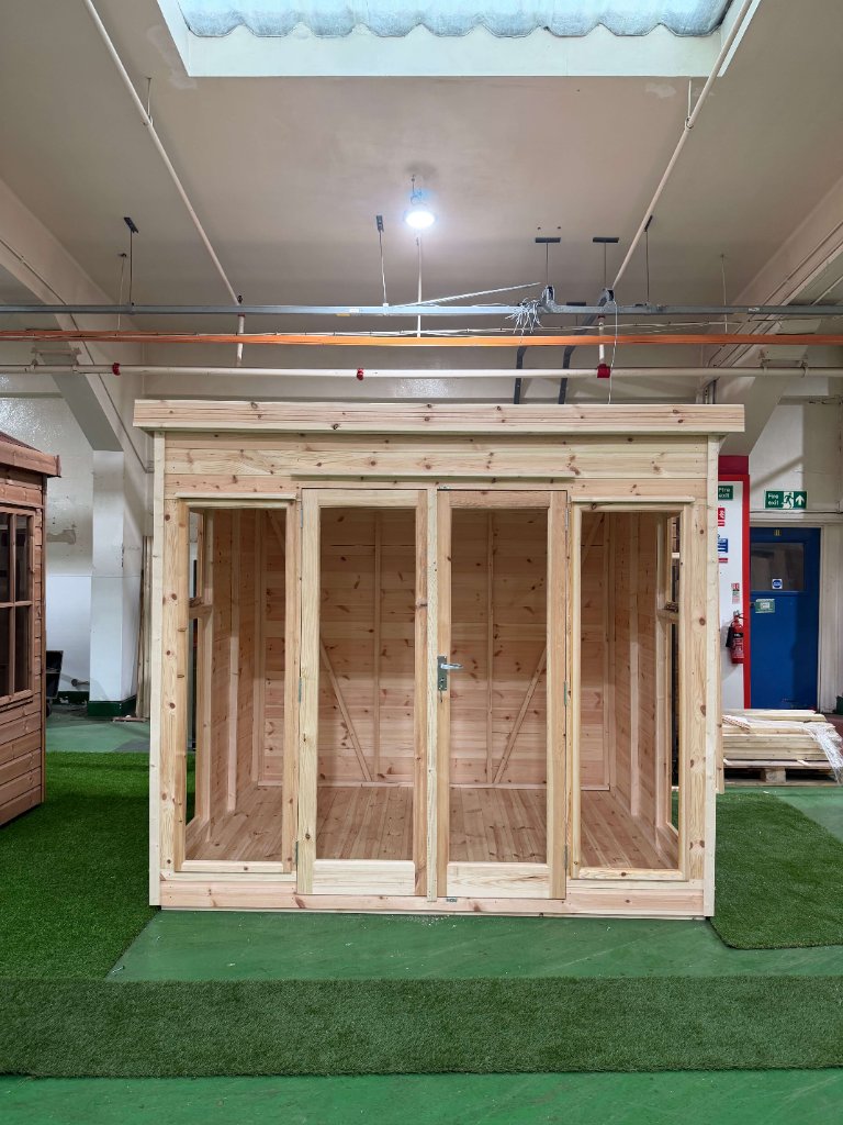 The Essex garden building - factory view with double doors and side windows