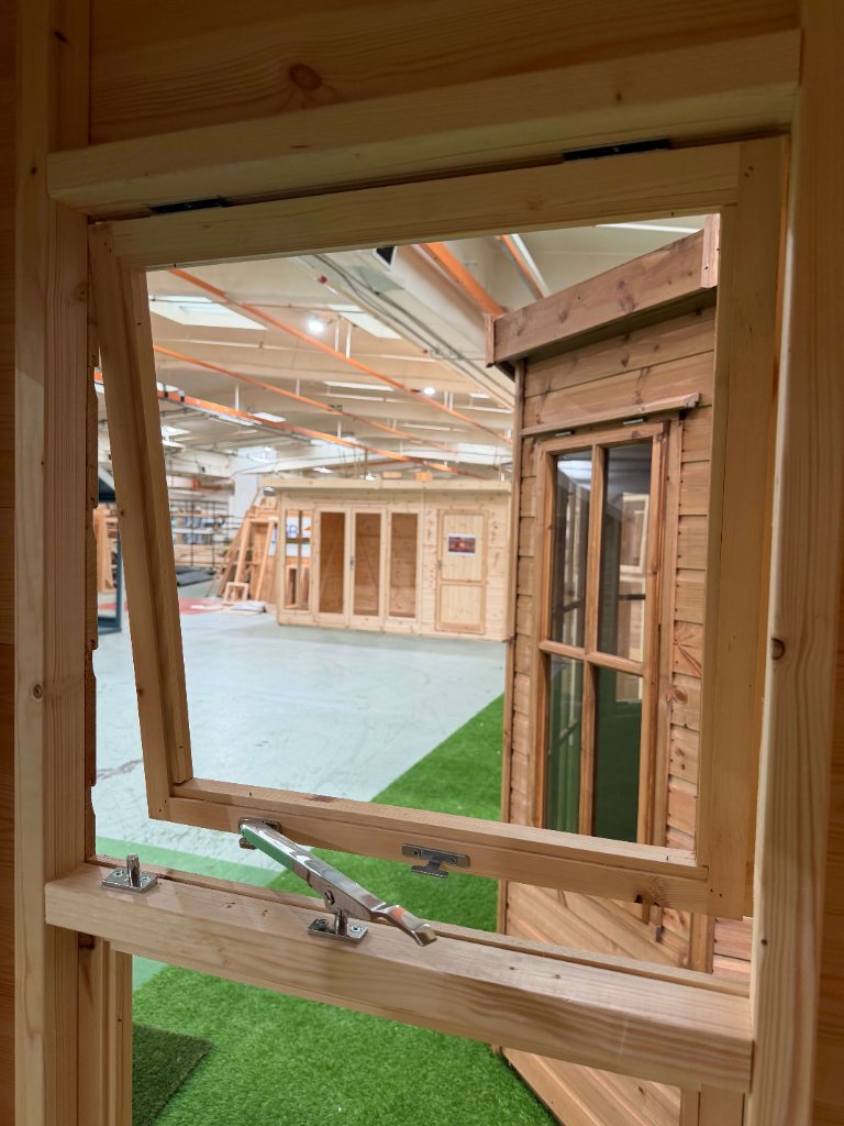 The Essex garden building - interior window hinge and stay detail