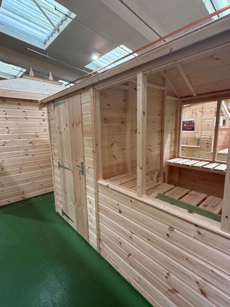 The Axbridge potting shed - interior corner with door and window