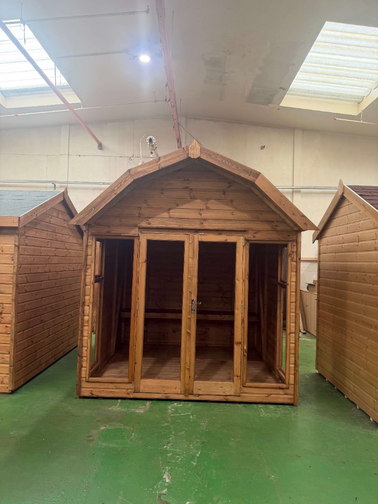 The Norfolk summerhouse - front view with double doors and side windows