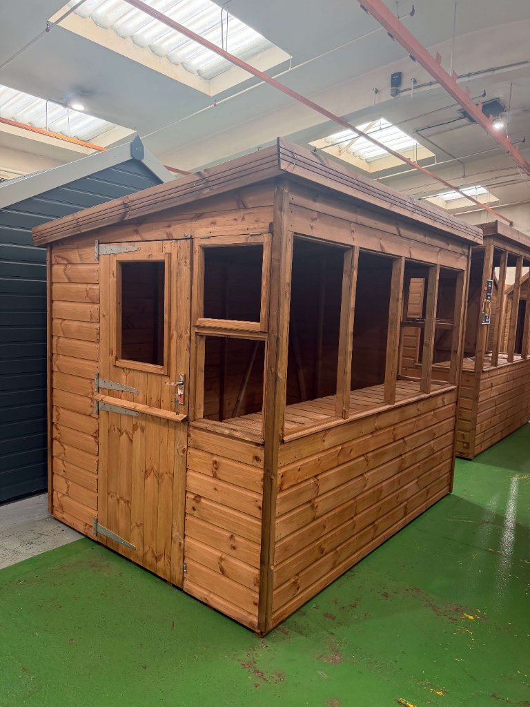 The Bath sun pent shed - stained finish front and side view