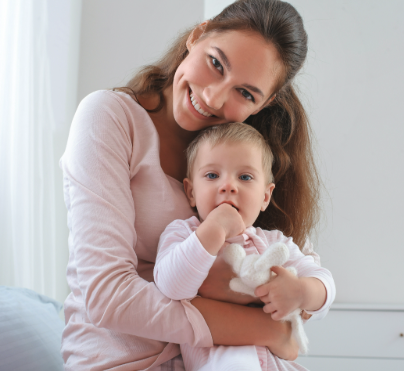 Sarah M., verified CAA client, with her child