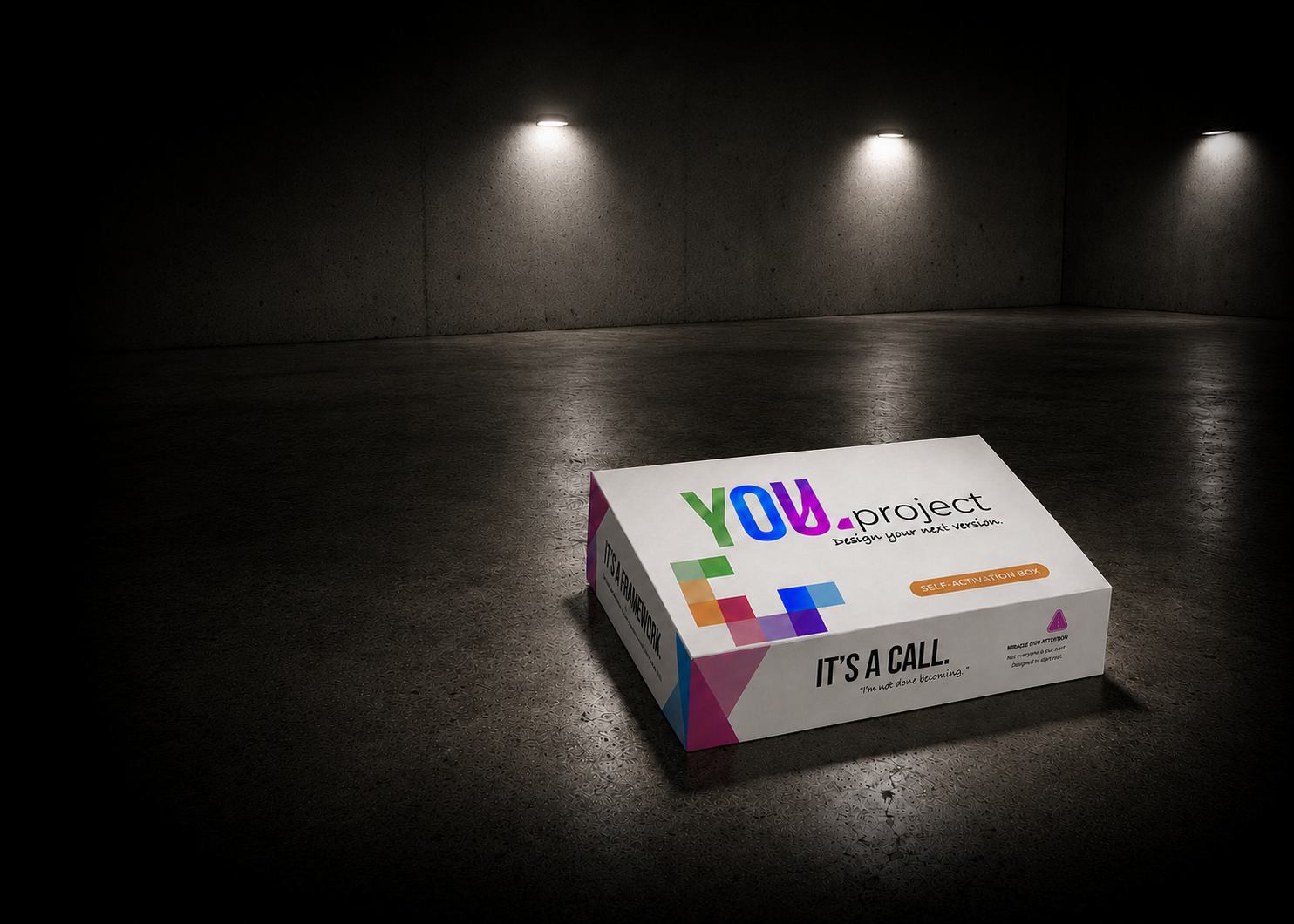 The YOU.project Self-Activation Box on a spotlit concrete floor