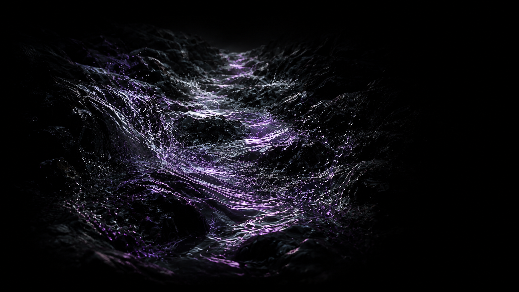 A narrow current beginning to form between dark rocks.