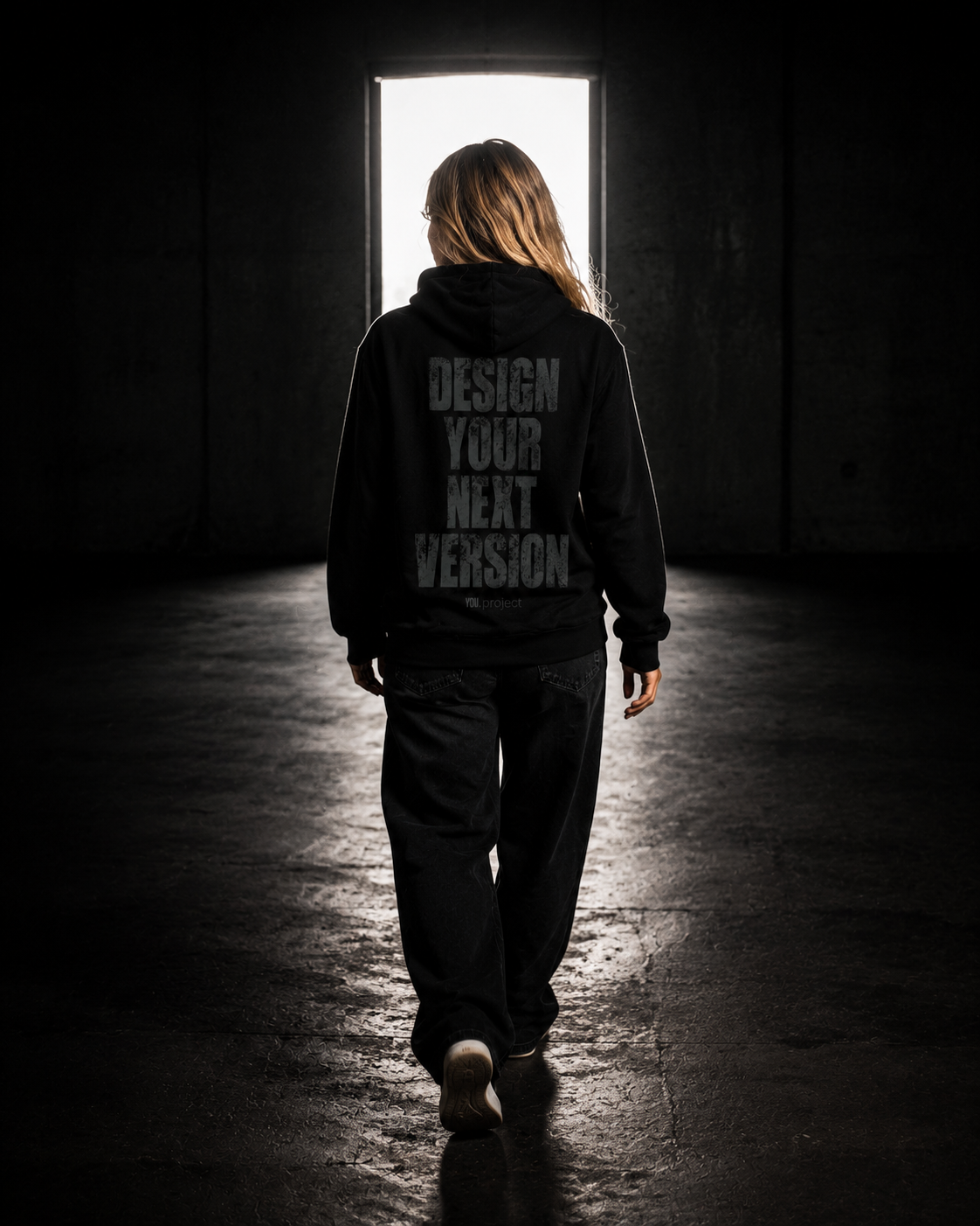 A person walking toward a bright doorway, leaving the dark behind.
