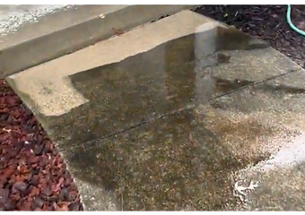 Wet concrete walkway section