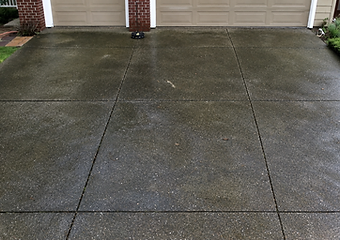 Stained driveway before washing