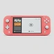 Front view of a coral Nintendo Switch Lite console with the home screen displayed on the handheld display