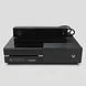 Black Xbox One 500GB console with Kinect sensor viewed from the front against a light background