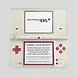 Open white and pink Nintendo DSi handheld console with a health and safety warning displayed on the bottom screen