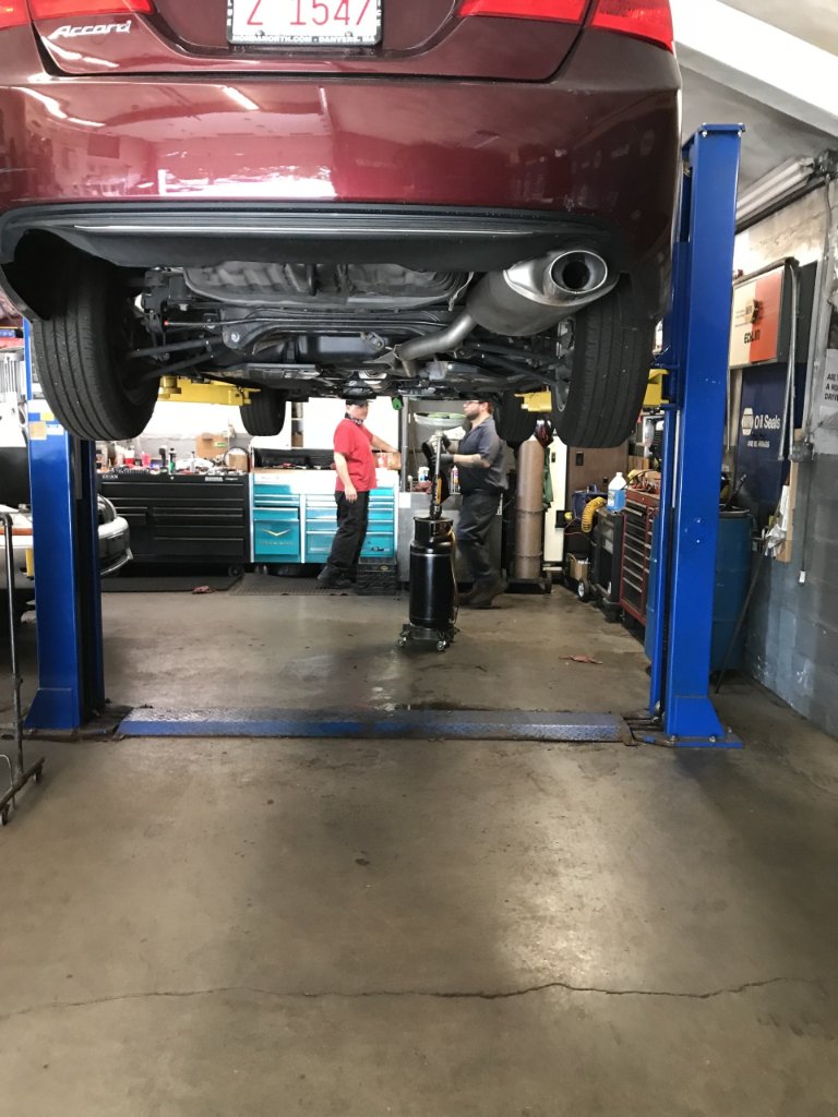Exhaust system inspection on the lift at Sacco's Auto Repair