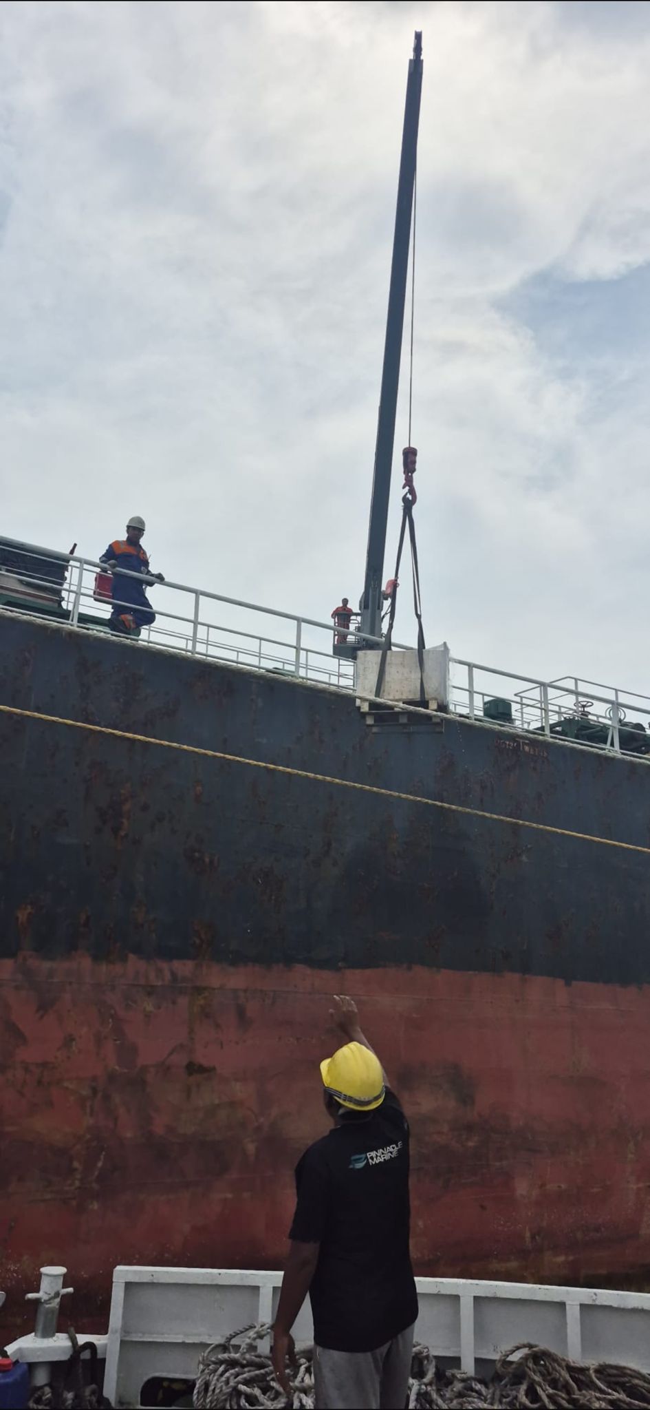 Air cooler unit being lifted back onboard a vessel by crane at anchorage