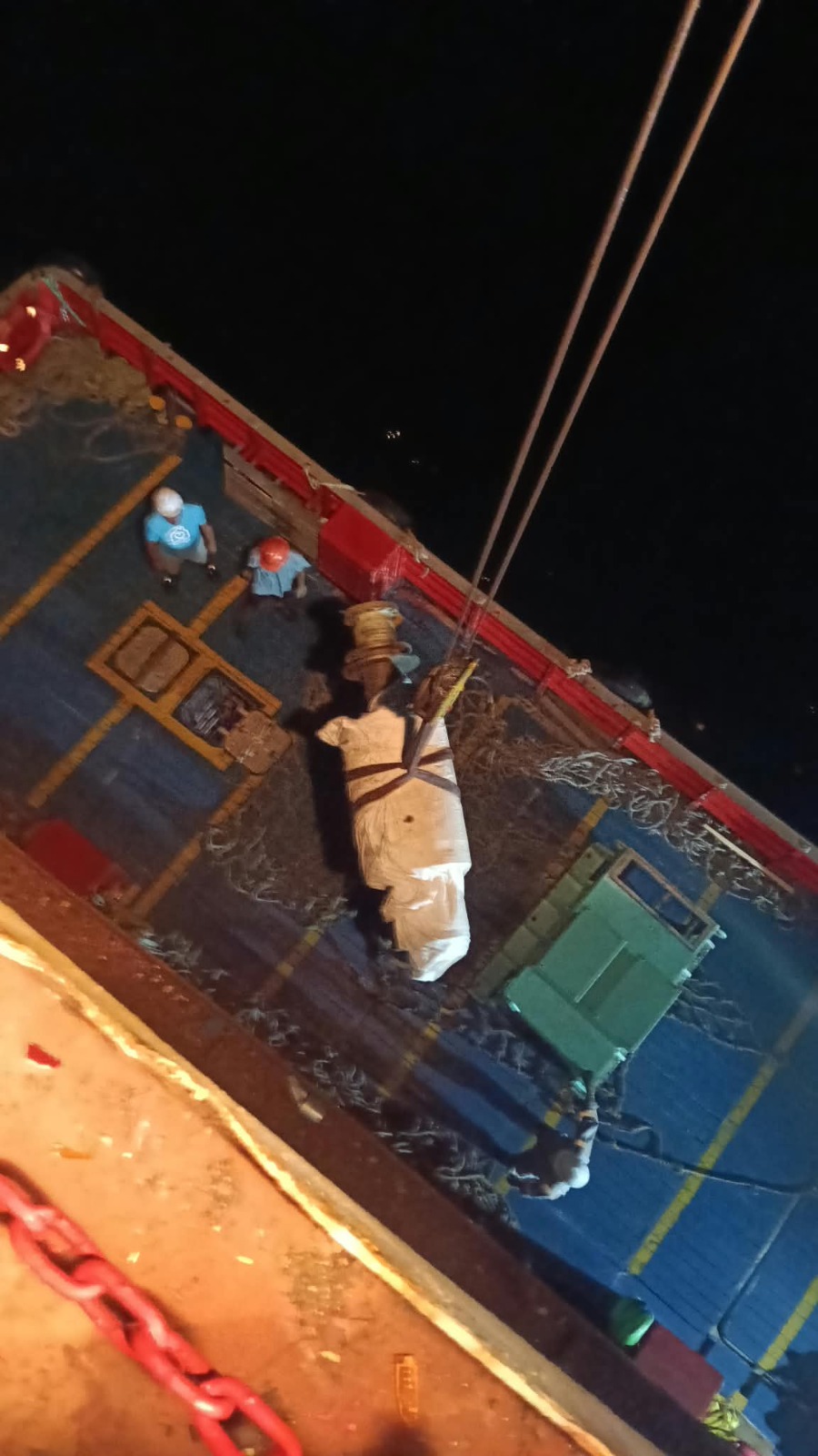 Crane lift of a wrapped cylindrical load with deck machinery during night operations