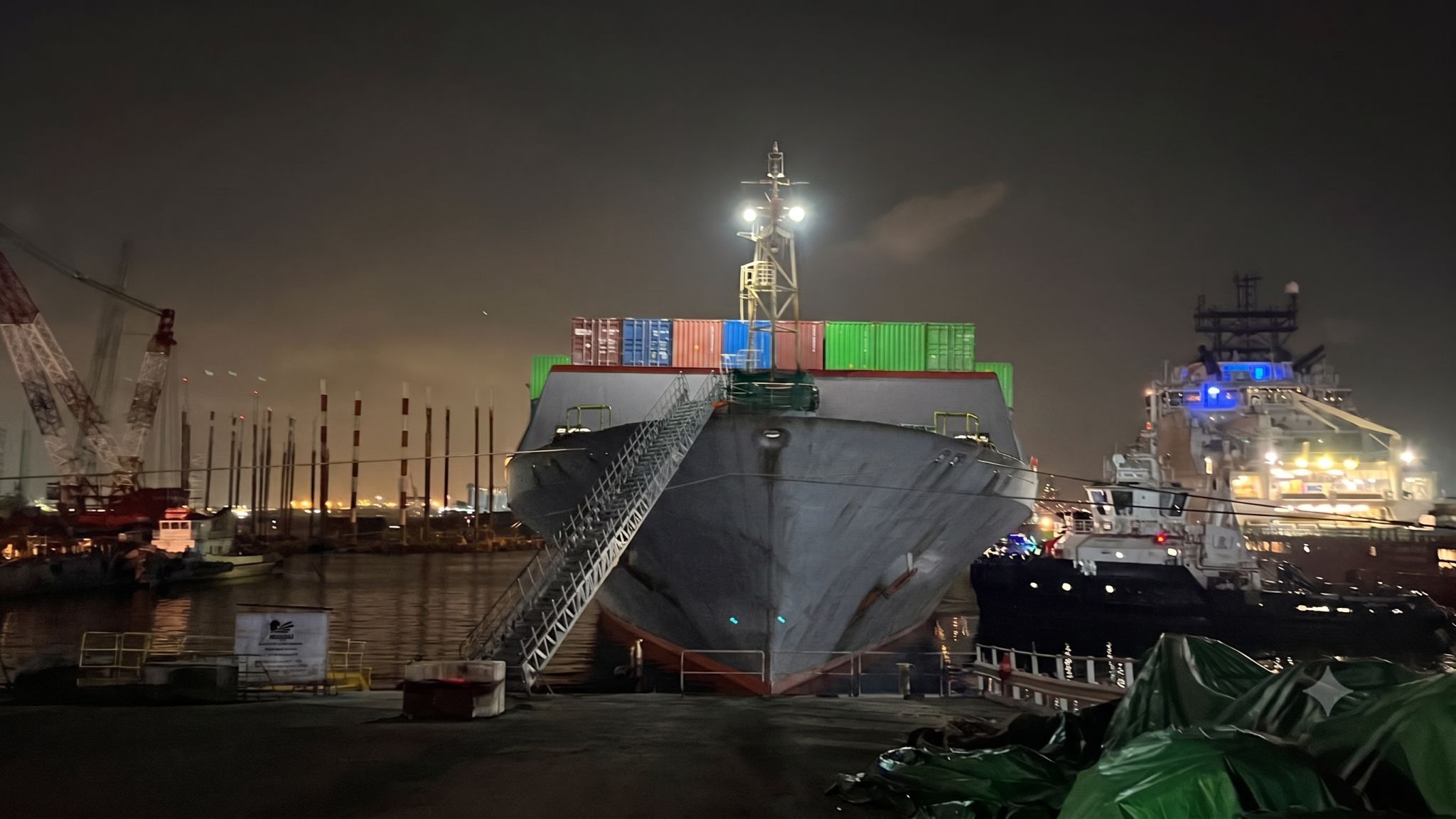 Container vessel alongside at night during the completed emergency anchor and chain replacement operation