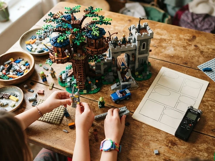 Kids building a LEGO world with a storyboard