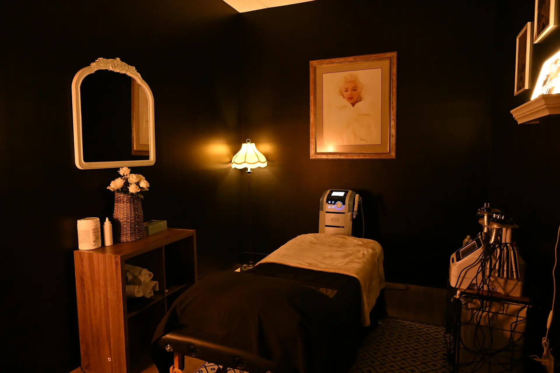 The moody, dimly lit Marilyn treatment room at Tulsa Body Sculpting