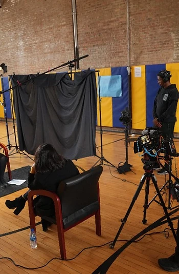 Shawn Brooks operating a cinema camera during a documentary interview production in Chicago