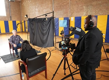 Shawn Brooks observing an interview during a Brookssmedia production