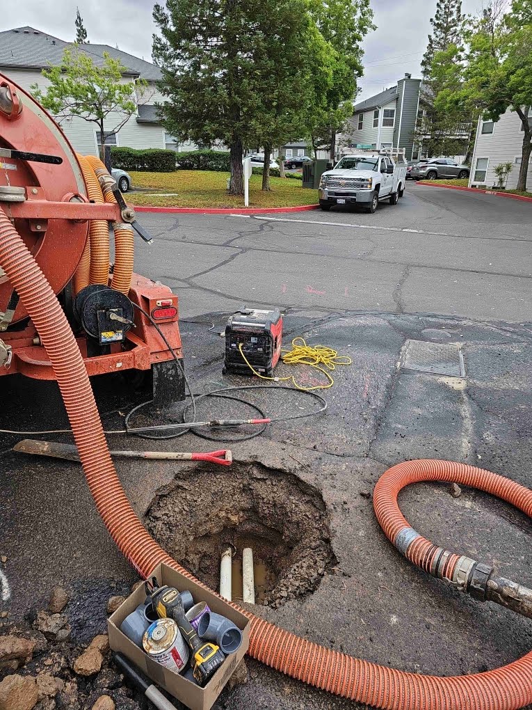 Excavation site with PVC pipe repair