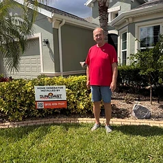 Happy Suncoast Power Solutions customer with their newly installed home generator yard sign