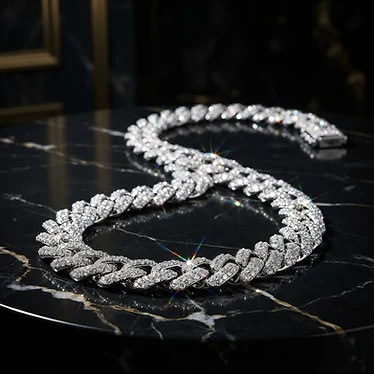 Iced out diamond Cuban link necklace on black marble
