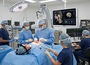 Intraoperative C-Arm — Intraoperative imaging and neurophysiology monitoring equipment in use during surgery