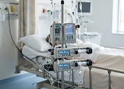 CONTEC SRP1 Automatic Pressure Infusor — Volumetric infusion pumps and syringe pumps mounted on an IV pole beside a patient bed
