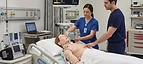 Laerdal SimMan 3G PLUS Patient Simulator — High-fidelity patient simulation manikin with monitor in a medical simulation training centre