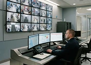 Metal Detector — Hospital security control room with CCTV surveillance monitor wall