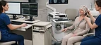 EEG Machine — EEG machine with electrodes and neuro navigation workstation in a neurology diagnostic room