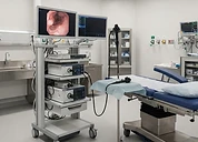 ERCP System — Endoscopy tower with video monitor and examination table in an endoscopy procedure room