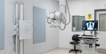 Mobile X-Ray Unit — Digital radiography X-ray machine with wall stand in a radiography room