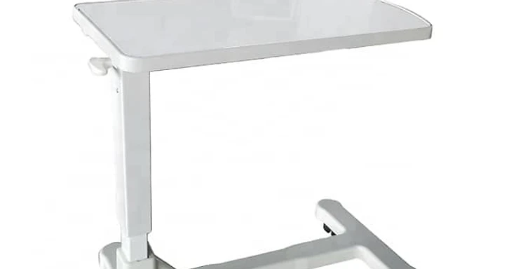 White ABS hospital overbed table with height-adjustable column, H-base frame and four black castors