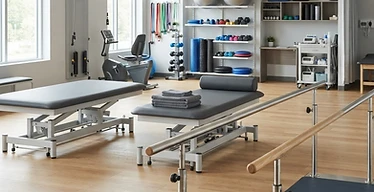 Traction Table — Parallel bars, therapy tables and exercise equipment in a physiotherapy rehabilitation gym