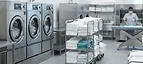 Theatre Linen Pack — Hospital laundry facility with industrial washing machines and clean linen carts