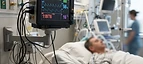 CONTEC CMS9100PLUS Portable Patient Monitor — Bedside multi-parameter patient monitor displaying vital signs in an intensive care unit