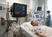 CONTEC MS100 SpO2 Simulator — Bedside multi-parameter patient monitor displaying vital signs in an intensive care unit