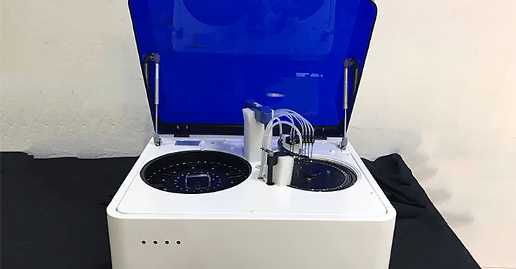 Medsinglong MSLBA55 automated biochemistry analyzer with blue hood open showing twin reagent trays and dual-probe arm