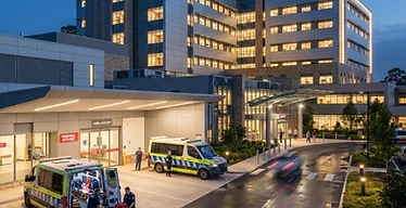 100-Bed Hospital Project — Completed modern hospital building exterior with ambulance bay