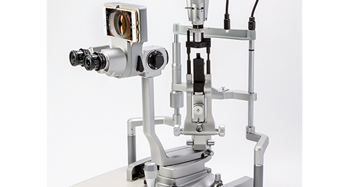 Marco iON digital imaging adapter mounted on a slit lamp biomicroscope with an iPhone displaying a live magnified eye image
