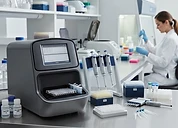 Electroporator — DNA sequencing instrument with micropipettes and sample plates in a genomics laboratory