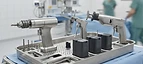Reamer System — Orthopaedic surgical drill, saw and battery packs on a sterile instrument tray