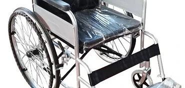 Standard manual wheelchair with silver tubular frame, black upholstery, fixed armrests, swing-away footrests and parking brake