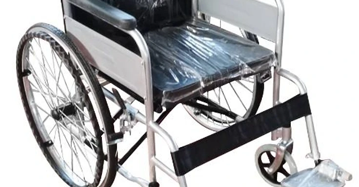 Standard manual wheelchair with silver tubular frame, black upholstery, fixed armrests, swing-away footrests and parking brake