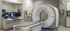 Portable CT Scanner — Computed tomography CT scanner gantry with patient table in a radiology room