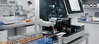Point-of-Care Chemistry Analyzer — Automated clinical chemistry analyser with sample racks in a hospital laboratory