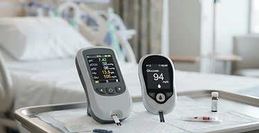 Cardiac Marker POC Analyzer — Handheld point-of-care blood gas and glucose analyser devices at a patient bedside