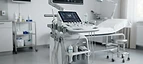 EPIQ Elite Ultrasound System — Cart-based ultrasound machine with monitor and transducer probes in an examination room